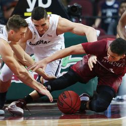 Brigham Young Cougars center Corbin Kaufusi (44) and Santa Clara Broncos guard Jarvis Pugh (4) fight for the ball during the West Coast Conference Basketball Championships in Las Vegas  Sunday, March 8, 2015.  BYU won 78-76. 