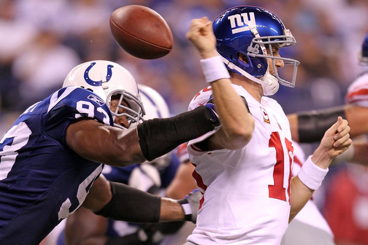 Dwight Freeney forces an Eli Manning fumble. Could he join the Giants in 2013?