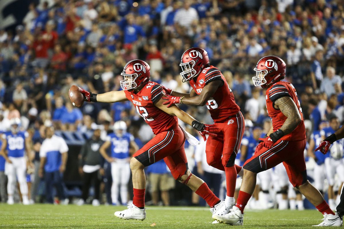 Utah defensive end Mika Tafua (42) runs out of the pile with a recovered fumble giving the Utes possession in BYU territory during the second half of the Utah-BYU game at LaVell Edwards Stadium in Provo on Thursday, Aug. 29, 2019.