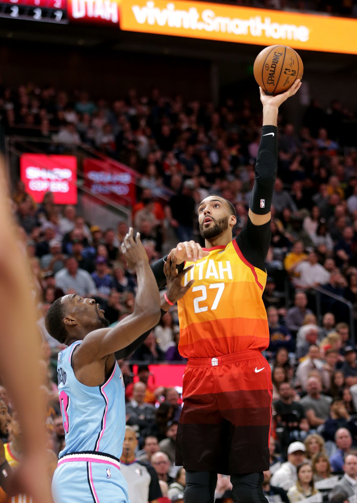 Utah Jazz center Rudy Gobert (27) pushes up a shot over Miami Heat forward Bam Adebayo (13) as the Utah Jazz and the Miami Heat play in an NBA basketball game at Vivint Smart Home Arena in Salt Lake City on Wednesday, Feb. 12, 2020.