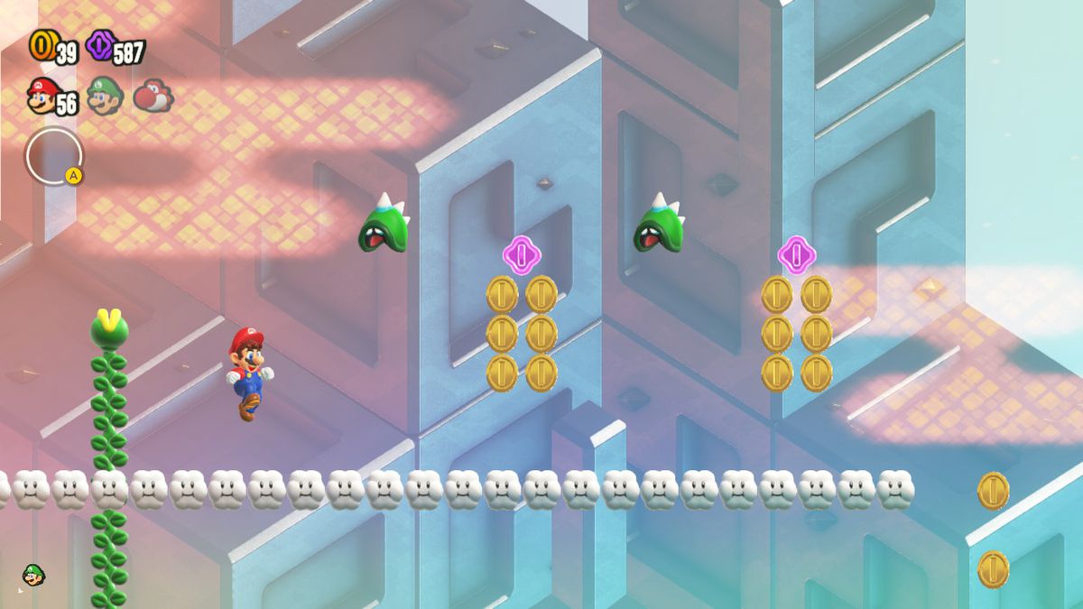 Mario jumps upward, as do two Hoppycats, in a screenshot from Super Mario Bros. Wonder