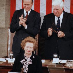 In a Feb. 20, 1985 file photo, British Prime Minister Margaret Thatcher is applauded by Vice President George Bush, left, as House Speaker Thomas P. O'Neill, Jr. looks on just before she addressed a joint meeting of the U.S. Congress, in Washington. Thatchers former spokesman, Tim Bell, said that the former British Prime Minister Margaret Thatcher had died Monday morning, April 8, 2013, of a stroke. She was 87. (AP Photo/Bob Daugherty, File)