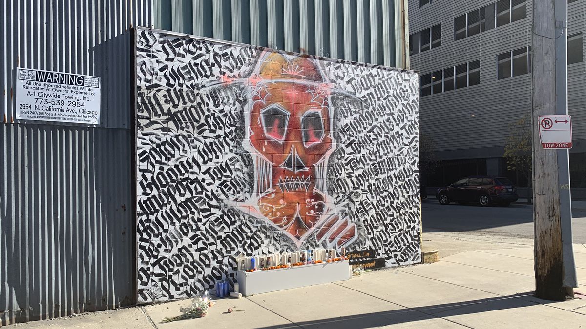 The Chicago artist who goes by the name Tubs painted this mural, titled “El Campesino,” on the side of an old mill at Ada Street and Carroll Avenue. The skull is a nod to his family’s Mexican roots. The names in the background are of people who have died of COVID-19.