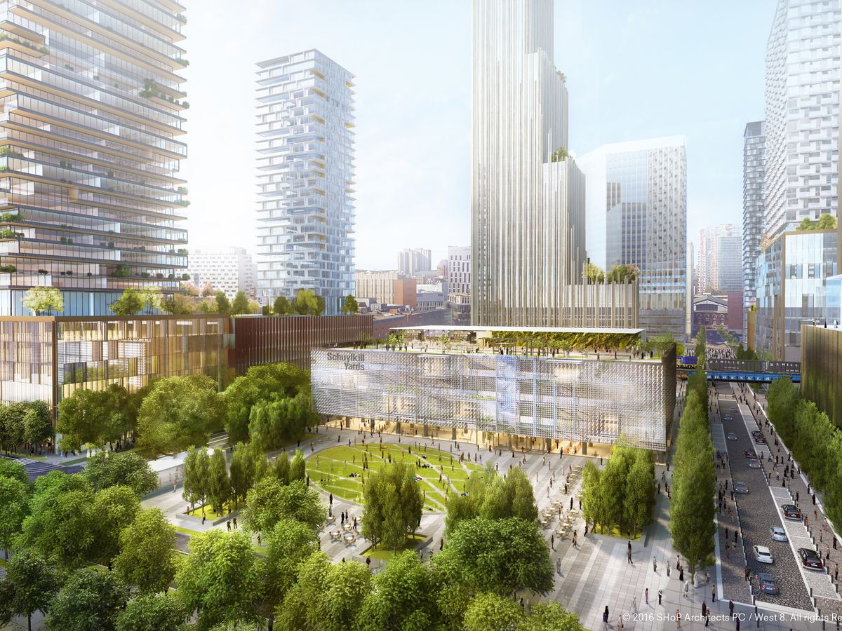 A rendering of Schuylkill Yards in Philadelphia. In the foreground is a park with trees and a lawn. In the distance are tall skyscrapers and buildings.