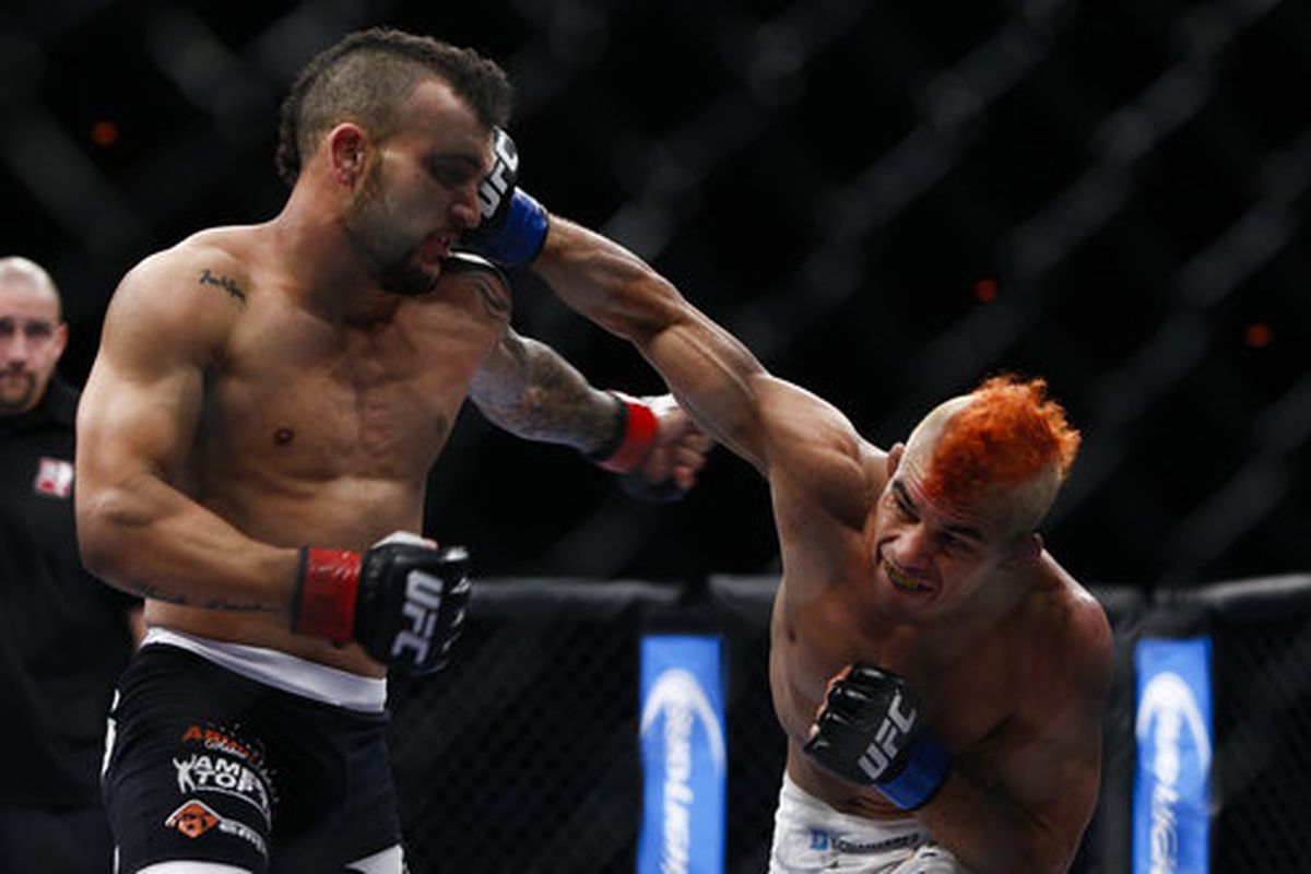 Jose Maria (right) lands a looping punch on the temple of John Lineker (left)