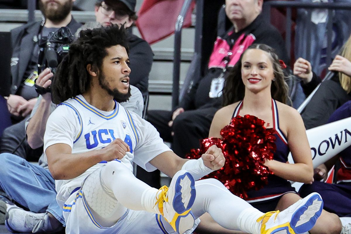 Tyger Campbell #10 of the UCLA Bruins reacts after scoring and drawing a foul against the Arizona Wildcats in the first half of the championship game of the Pac-12 basketball tournament at T-Mobile Arena on March 11, 2023 in Las Vegas, Nevada. The Wildcats defeated the Bruins 61-59.