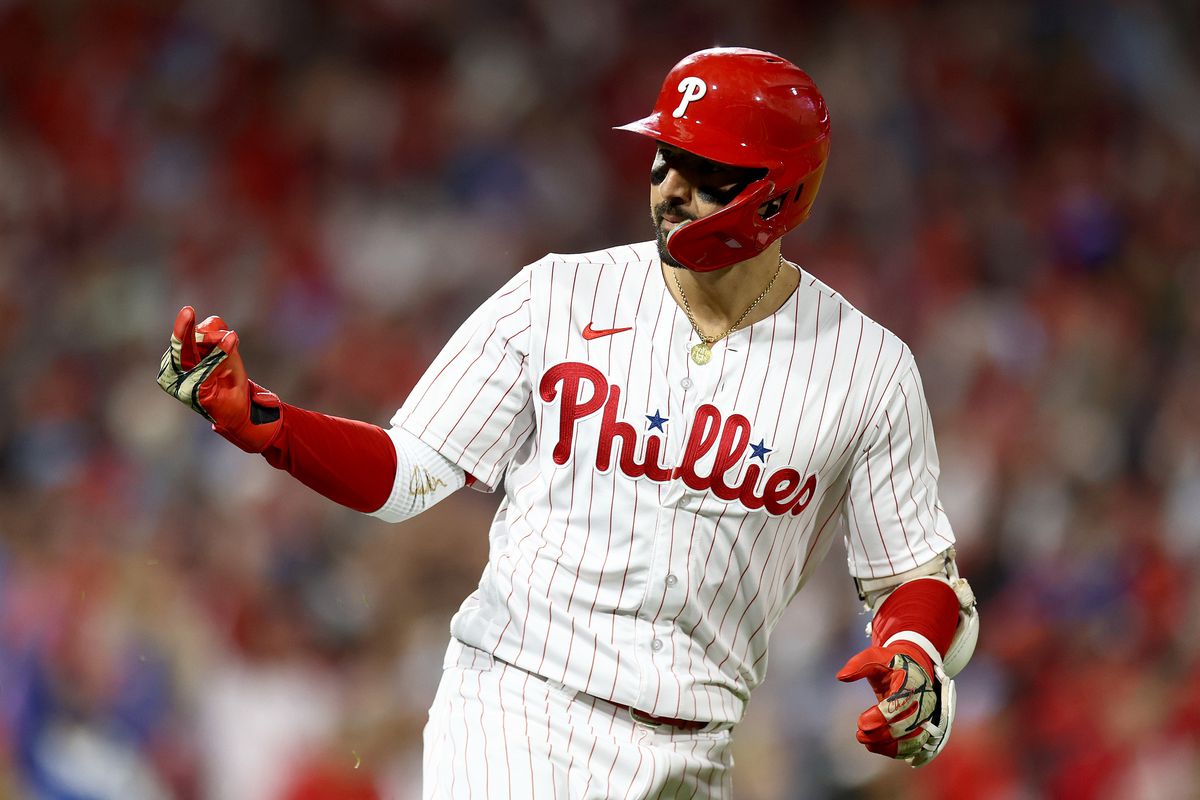 Nick Castellanos of the Philadelphia Phillies gestures to the dugout after hitting a solo home run in the second inning against the Arizona Diamondbacks during Game One of the Championship Series at Citizens Bank Park on October 16, 2023 in Philadelphia, Pennsylvania.