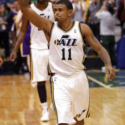 Utah Jazz point guard Earl Watson (11) waves to the crowd after beating  the Lakers in Salt Lake City  Saturday, Feb. 4, 2012. The Jazz won 96-87.