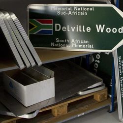 Newly made signs are set on a shelf in a warehouse, waiting to be shipped to locations around the world, at the Commonwealth War Graves Commission in Beaurains, France, on Wednesday, April 17, 2013. The signs will be shipped to Commonwealth cemeteries and monuments around the world which are currently being renovated in preparation for centenary events which begin in 2014. 