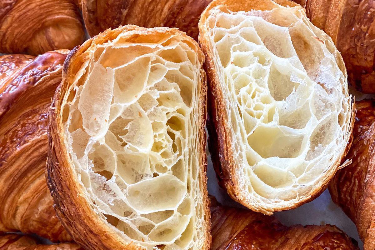 A croissant cut in half from Le Marais Bakery
