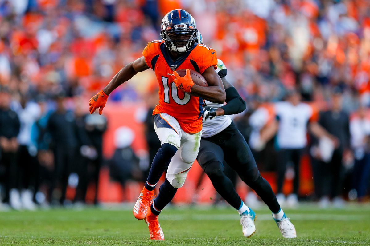 Wide receiver Emmanuel Sanders of the Denver Broncos runs with the football away from Cornerback A.J. Bouye of the Jacksonville Jaguars during the fourth quarter at Empower Field at Mile High on September 29, 2019 in Denver, Colorado.