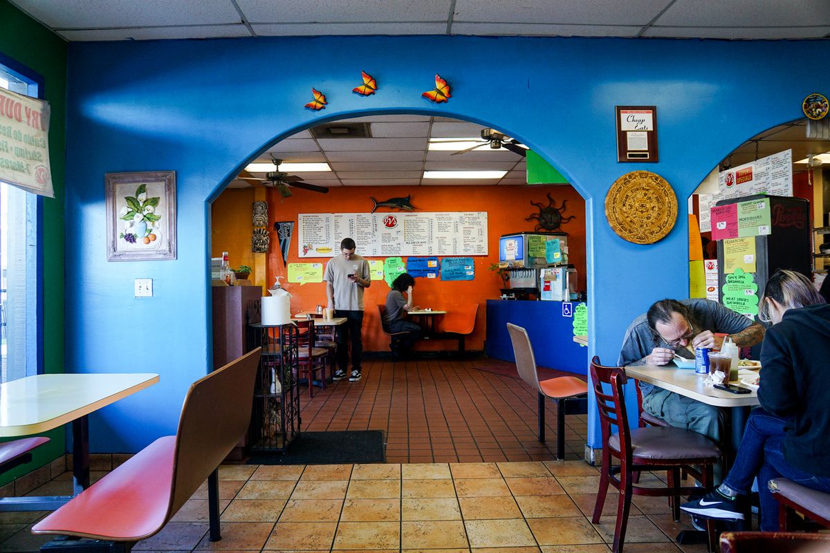 A colorful dining room at a taco shop.