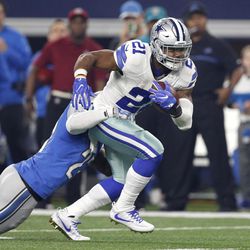 Detroit Lions' Darius Slay (23) attempts to stop Dallas Cowboys' Ezekiel Elliott (21) in the first half of an NFL football game, Monday, Dec. 26, 2016, in Arlington, Texas. 