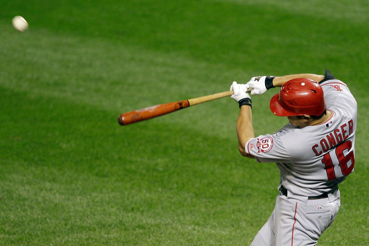<strong>Hank Conger</strong> #16 of the Los Angeles Angels of Anaheim connects for a two RBI home run at Camden Yards on September 16, 2011 in Baltimore, Maryland.