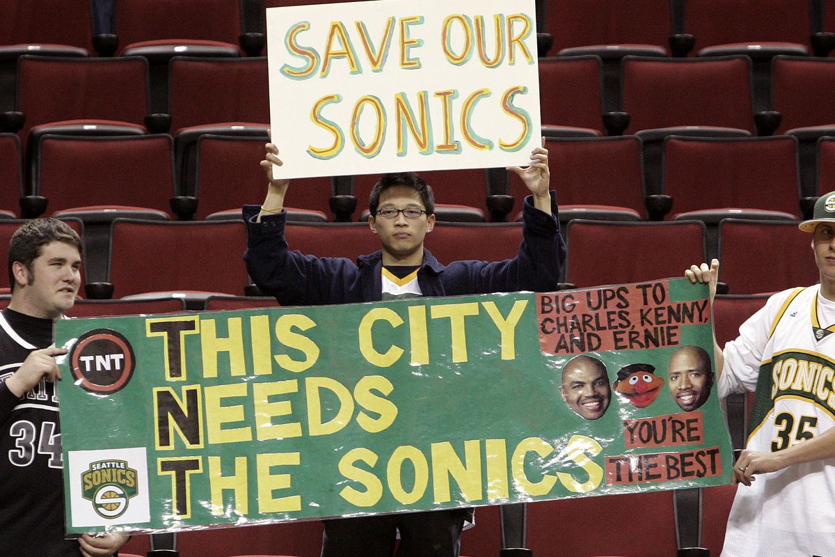 Seattle fans holding up signs to “Save our Sonics”