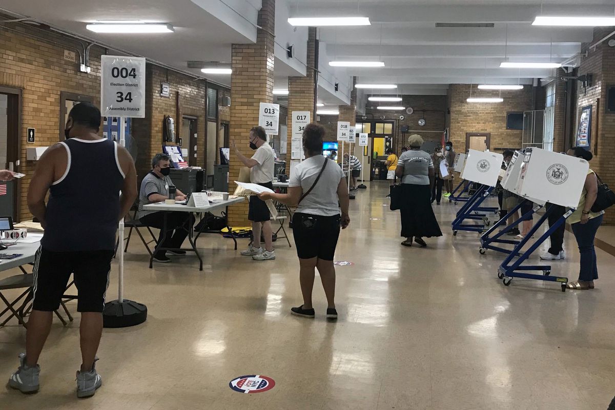 People vote during the Democratic primary at PS 149 in Jackson Heights, Queens, June 23, 2020.