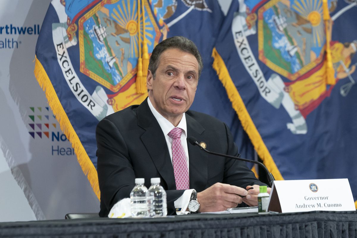 Governor Cuomo speaks at a press conference in Long Island in front of a New York State flag on 6 May