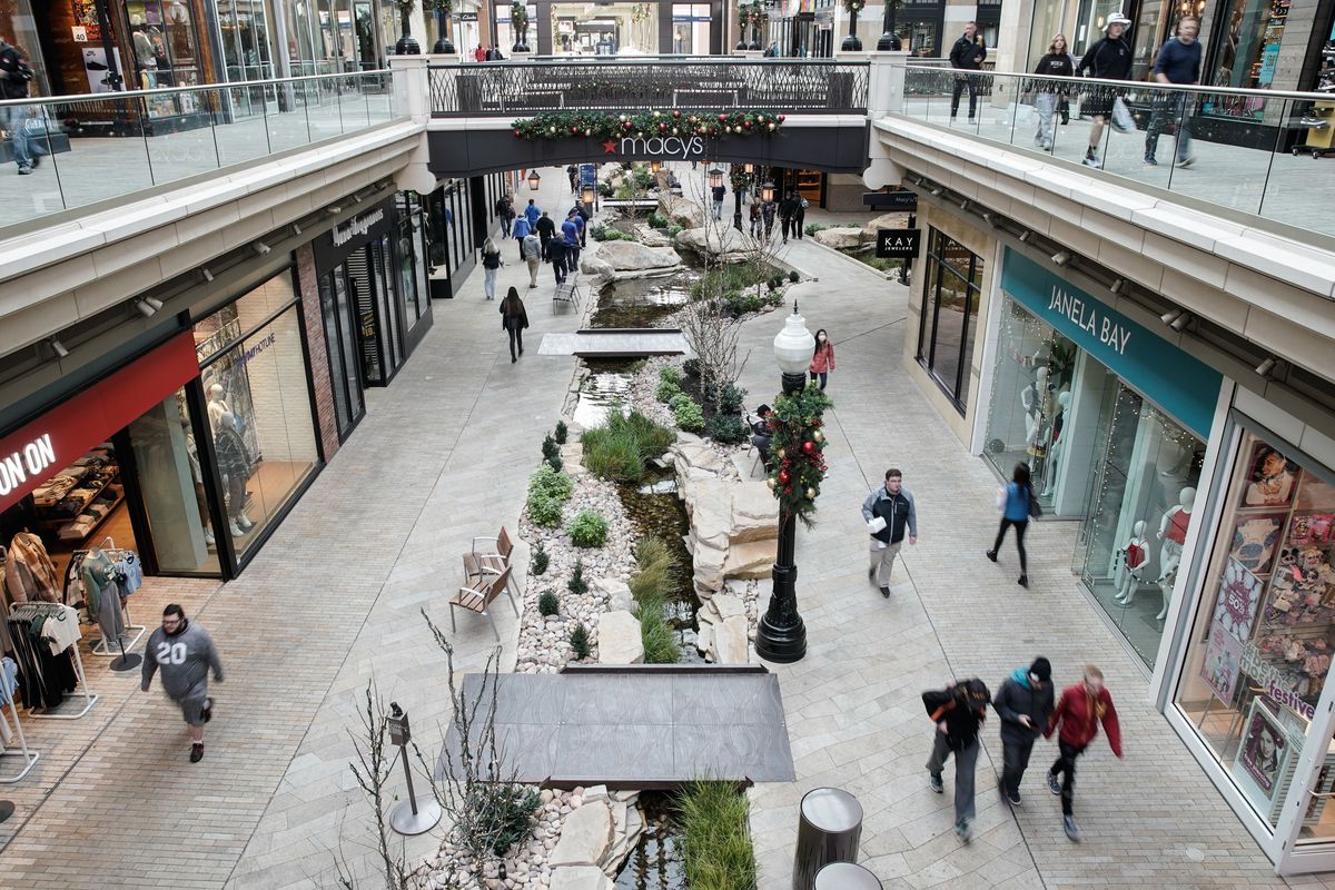 Shoppers walk through City Creek Center in Salt Lake City on Wednesday, Dec. 8, 2021.