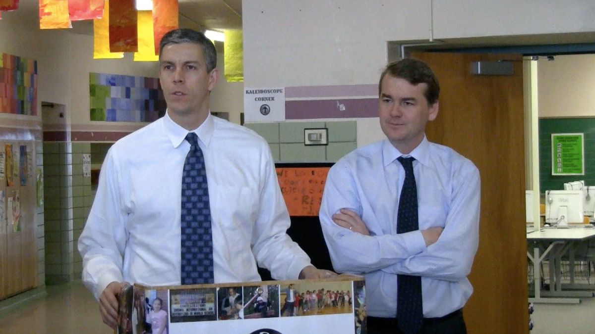 U.S. Education Secretary Arne Duncan, left, and U.S. Sen. Michael Bennet, D-Colorado, met with reporters Friday.