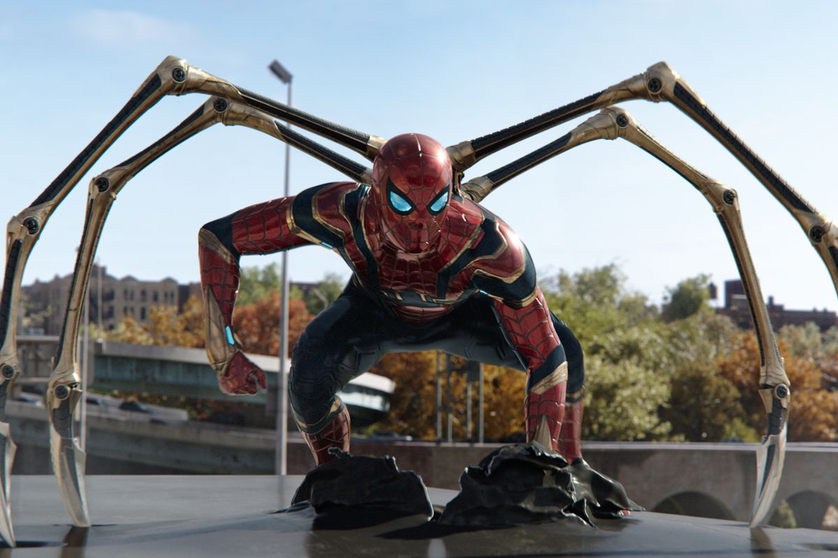 Spider-Man strikes a pose in his Iron Spider armor with his robot spider legs extended in Spider-Man: No Way Home