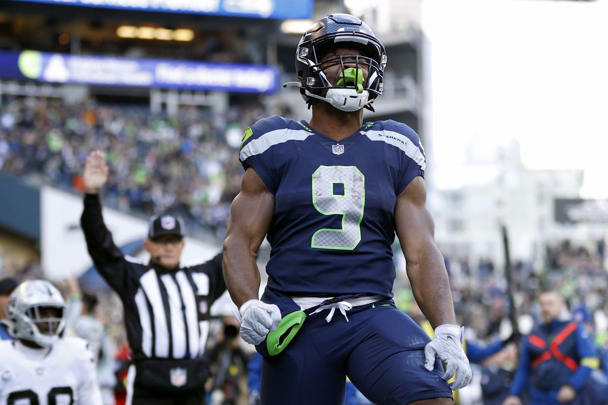 SEATTLE, WASHINGTON - NOVEMBER 27: Kenneth Walker III #9 of the Seattle Seahawks celebrates his touchdown against the Las Vegas Raiders during the first quarter at Lumen Field on November 27, 2022 in Seattle, Washington.  &nbsp;   
