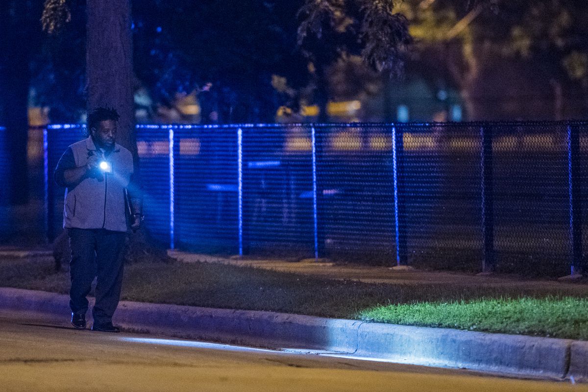 Chicago police investigate multiple people shot Monday night near Ellis Park in Chicago. | Tyler LaRiviere/Sun-Times