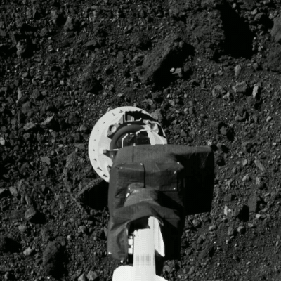 An animation of still images showing the OSIRIS-REx grabbing its rock sample from Bennu.