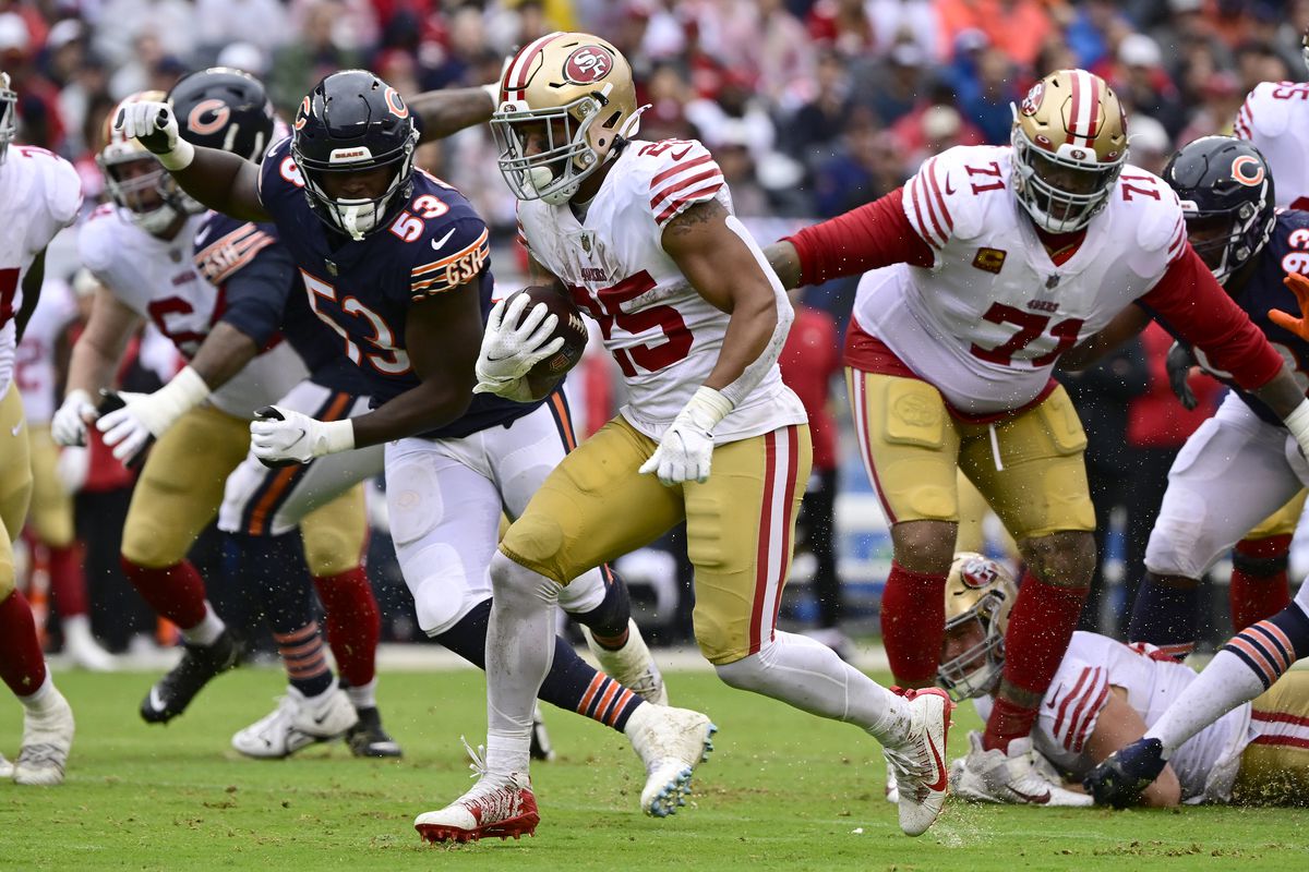 Elijah Mitchell #25 of the San Francisco 49ers rushes for a first down in the second quarter against the Chicago Bears at Soldier Field on September 11, 2022 in Chicago, Illinois.