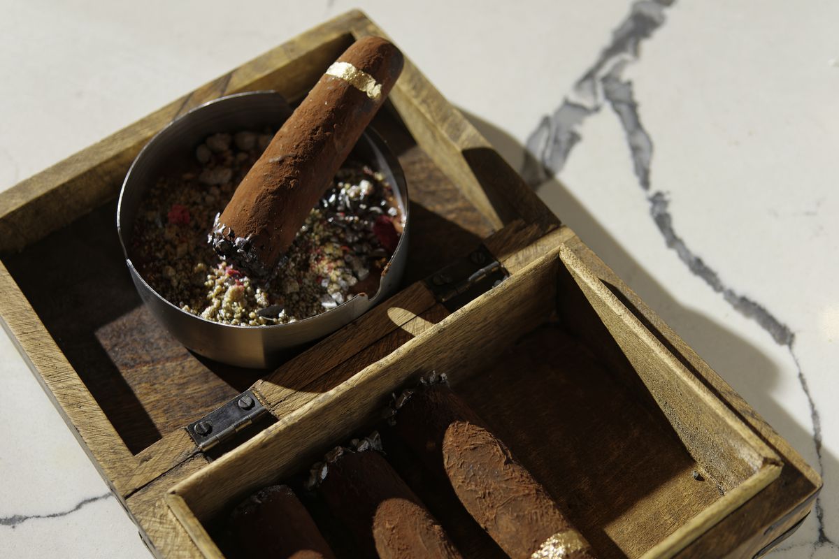A chocolate cigar and ashtray