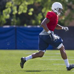 Wide receiver Ross Apo runs a drill during a BYU football practice at BYU's practice fields Thursday, Aug. 14, 2014.