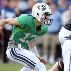 Brigham Young Cougars quarterback Koy Detmer, Jr. (13) looks for a running lane during a spring football scrimmage at LaVell Edwards Stadium in Provo, Saturday, March 26, 2016.