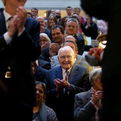 Elder L. Tom Perry, a member of the Quorum of the Twelve Apostles of The Church of Jesus Christ of Latter-day Saints, applauds after Gov. Gary Herbert signed SB296 at the Capitol in Salt Lake City on Thursday, March 12, 2015.
