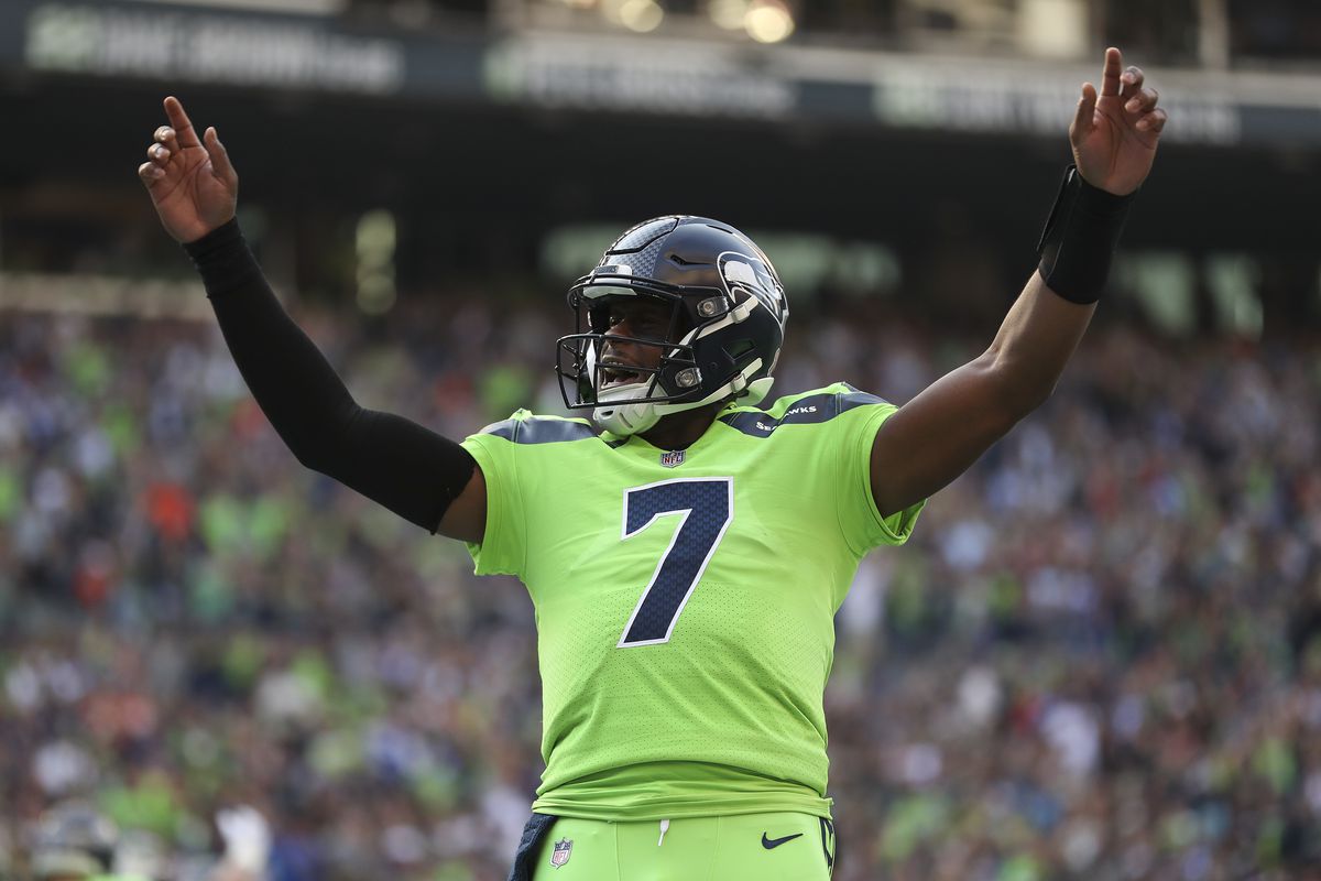 Geno Smith #7 of the Seattle Seahawks celebrates during the first quarter against the Denver Broncos at Lumen Field on September 12, 2022 in Seattle, Washington.