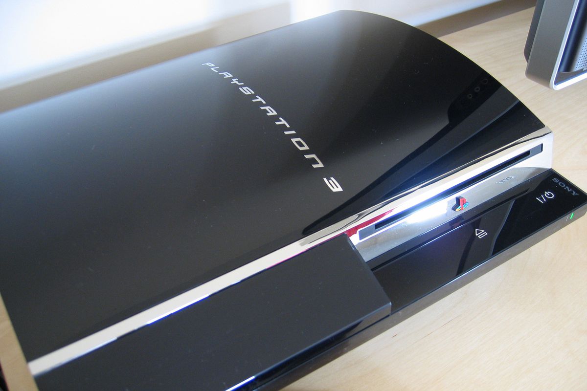 A picture of the PlayStation 3’s launch model, with the original “Spider-Man” typeface and metallic trim.