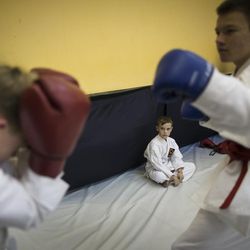 In this photo taken on Friday, Oct. 28, 2016, Russian children attend a kickboxing training in Verkhnyaya Pyshma, just outside Yekaterinburg, Russia. The training has been run by Yunarmia (Young Army), an organization sponsored by the Russian military that aims to encourage patriotism among the Russian youth. 
