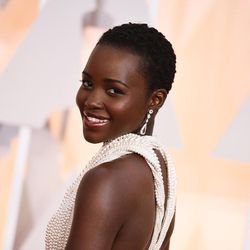 Lupita Nyong'o arrives at the Oscars on Sunday, Feb. 22, 2015, at the Dolby Theatre in Los Angeles. 