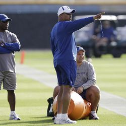 Indianapolis Colts coach Jim Caldwell, center, gives directions during NFL football practice, on Wednesday, Feb. 3, 2010, in Davie, Fla. The Colts will face the New Orleans Saints in Super Bowl XLIV on Sunday in Miami.