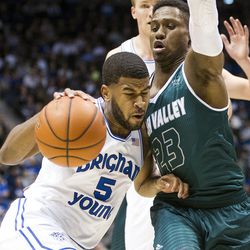 Brigham Young guard L.J. Rose (5) tries to get around Utah Valley guard Brandon Randolph (23) during an NCAA college basketball game in Provo on Saturday, Nov. 26, 2016. Utah Valley was 18 of 37 from beyond the arc en route to a 114-101 ousting of Brigham Young.