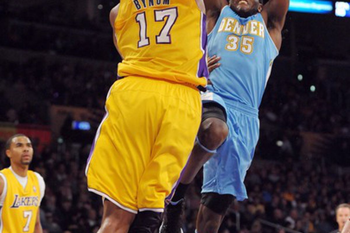 Apr 13, 2012; Los Angeles, CA, USA; Denver Nuggets forward Kenneth Faried (35) is defended by Los Angeles Lakers center Andrew Bynum (17) at the Staples Center. Mandatory Credit: Kirby Lee/Image of Sport-US PRESSWIRE