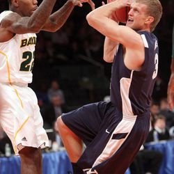 Brigham Young Cougars guard Tyler Haws (3) drives on Baylor Bears guard A.J. Walton (22) during the NIT Final Four in New York City Tuesday, April 2, 2013.