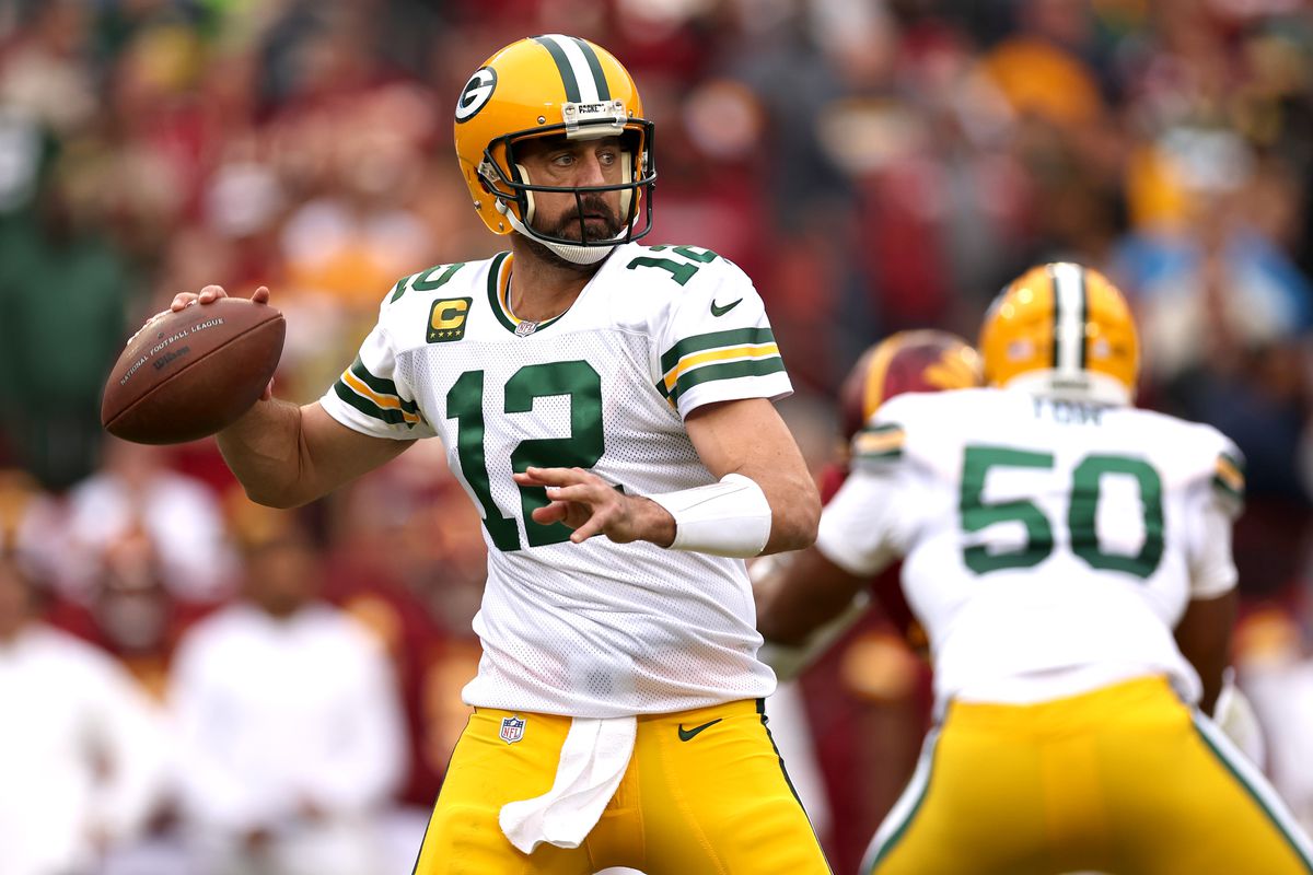 Aaron Rodgers #12 of the Green Bay Packers attempts a pass during the third quarter of the game against the Washington Commanders at FedExField on October 23, 2022 in Landover, Maryland.