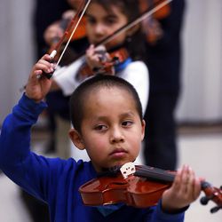 Christian Segovia learns violin during an after-school program at Mountain View Elementary in Salt Lake City on Monday, March 7, 2016.