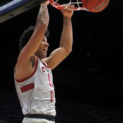 Stanford guard Dorian Pickens (11) dunks against BYU during the first half of an NCAA college basketball game in the first round of the NIT on Wednesday, March 14, 2018, in Stanford, Calif. (AP Photo/ Tony Avelar)