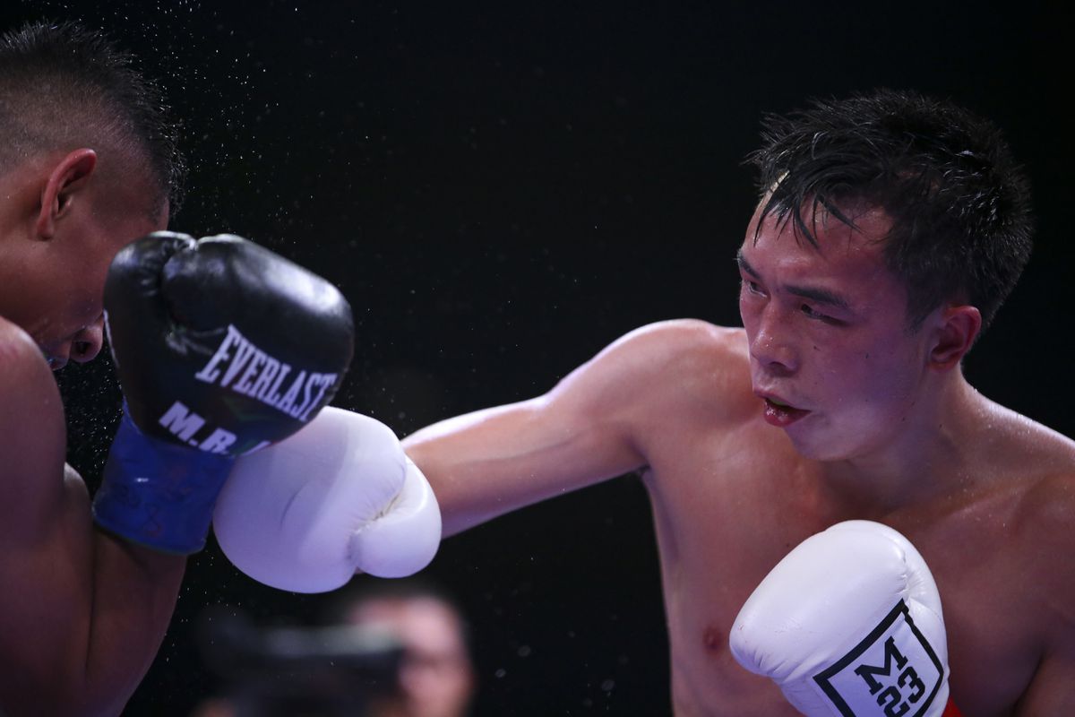China’s Xu Can R fights with U.S. challenger Manny Robles III in Indio, the United States, Nov. 23, 2019. China’s first World Boxing Association (WBA) champion Xu Can succeeded in defending his WBA featherweight title after defeating U.S. challenger Manny Robles III on Saturday night in California.
