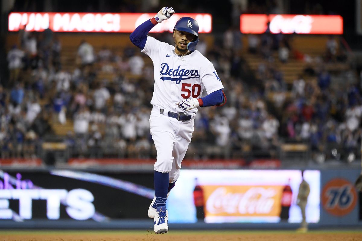 LOS ANGELES, CA - SEPTEMBER 03: Mookie Betts #50 of the Los Angeles Dodgers celebrates after hitting three-run home run during the fourth inning against starting pitcher Sean Manaea #55 of the San Diego Padres at Dodger Stadium on September 3, 2022 in Los Angeles, California.