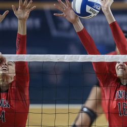 UNLV setter Alexis Patterson (04) and middle blocker Elsa Descamps (16) defend at the net in an NCAA first round match against Utah at Smith Fieldhouse in Provo on Friday, Dec. 2, 2016.