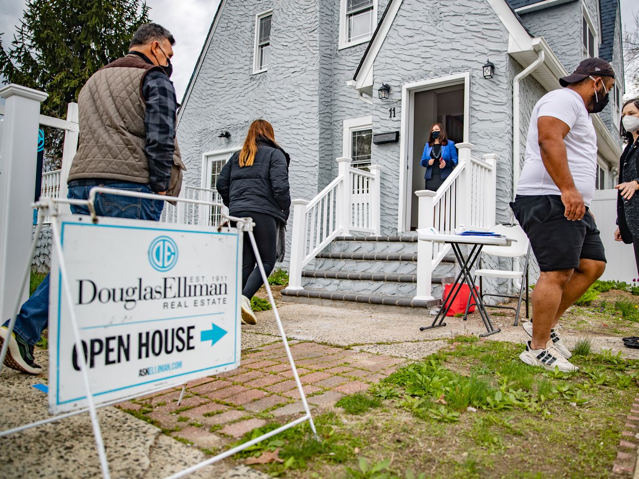 Long Island real estate agents work an open house.