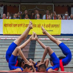 Students perform yogasanas during the 71st Independence Day celebrations at the MIT World Peace University in Pune, Maharashtra, India, on August 15, 2017.