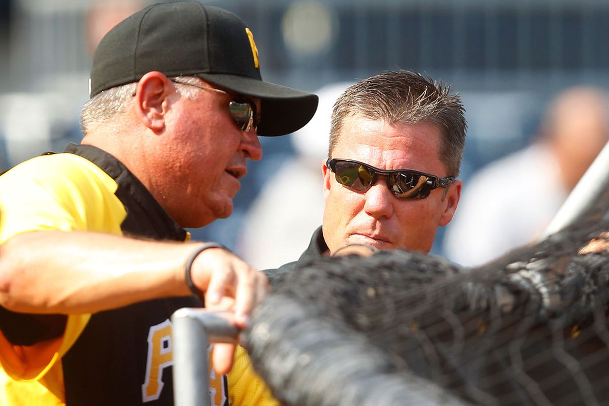 PITTSBURGH - JULY 23:  Manager Clint Hurdle #13 of the Pittsburgh Pirates talks with President Frank Coonelly during batting practice before the game on July 23, 2011 at PNC Park in Pittsburgh, Pennsylvania.  (Photo by Jared Wickerham/Getty Images)