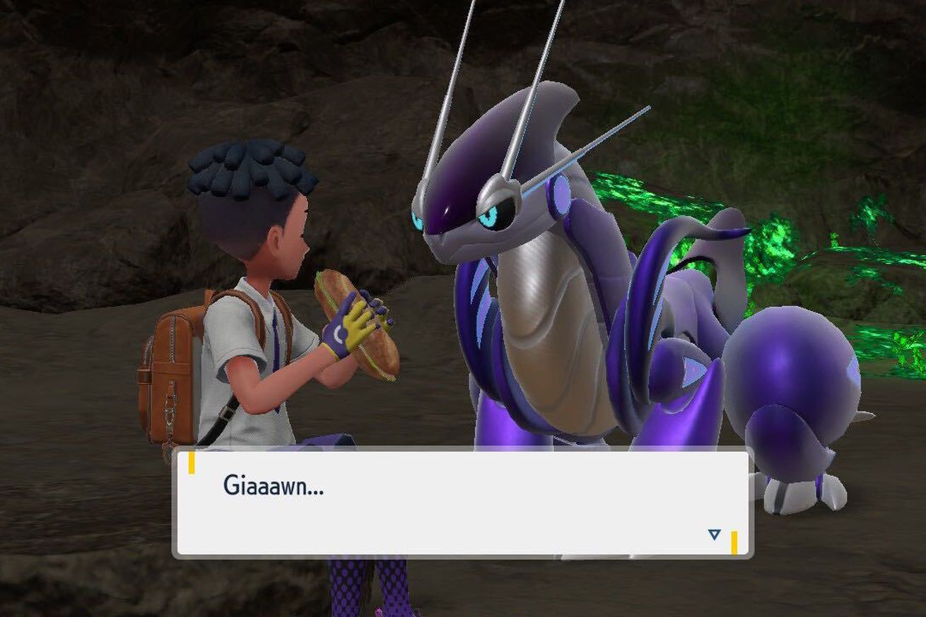 A pokémon trainer sitting in a cave and eating a sandwich with a dragon that looks like a futuristic motorcycle.